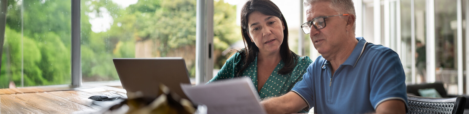 Photo of a man and a woman looking paperwork